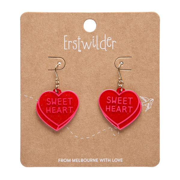pair "SWEET HEART" text candy heart dangle earrings in red glitter resin, shown on branded backer card packaging