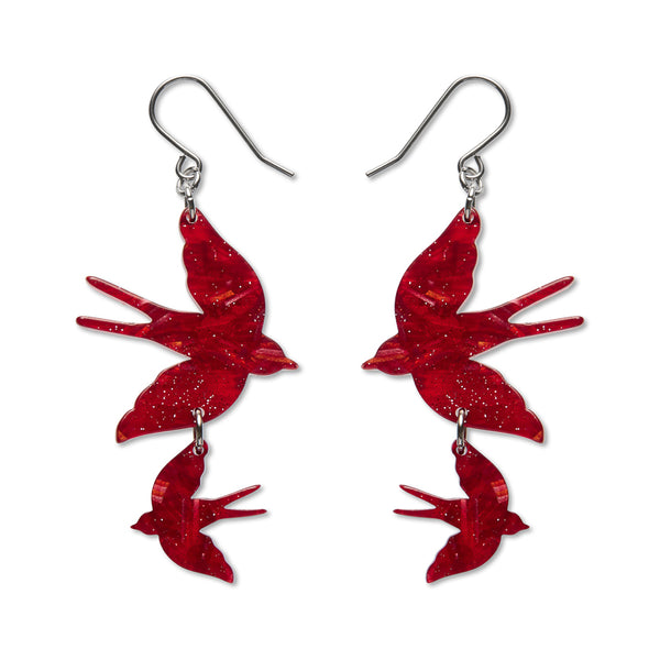 Red bird-shaped earrings on a white background