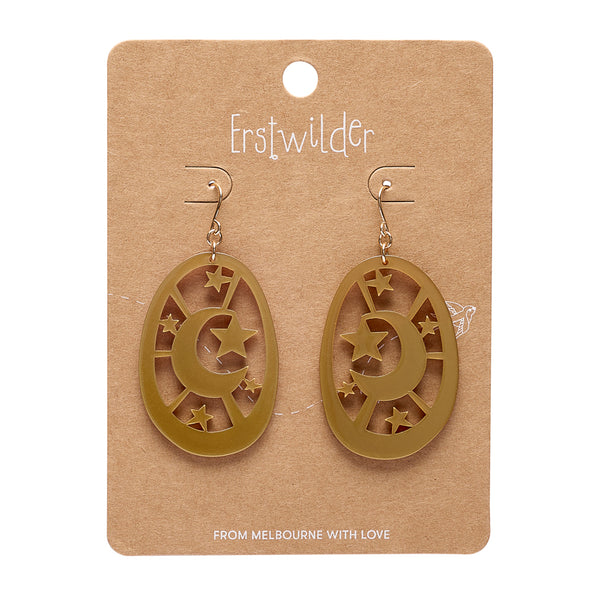 gold acrylic resin star and moon motif oval dangle earrings, shown on erstwilder branded backer card
