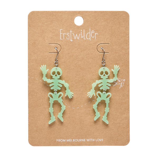 A pair of mint green skeleton dangle earrings on a brown kraft paper display card by Erstwilder, with 'FROM MELBOURNE WITH LOVE' printed at the bottom.