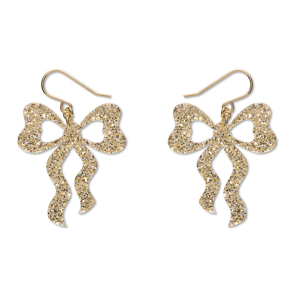A pair of gold glitter bow drop earrings with fishhook wires, displayed on a clean white background.