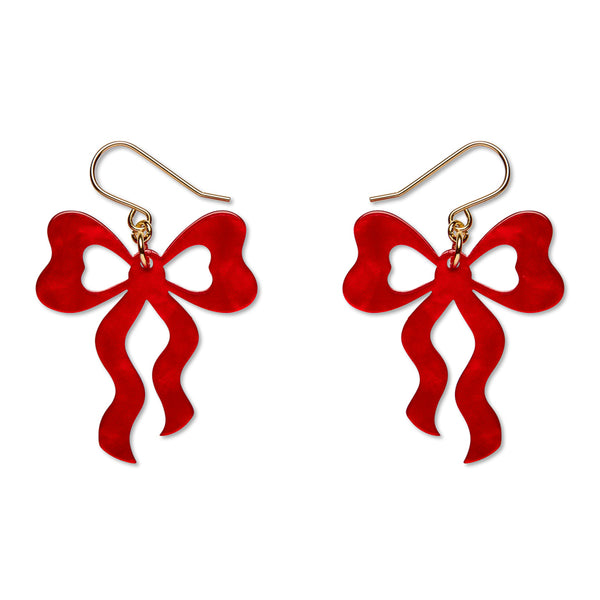 A pair of dangling bow-shaped earrings with bright red cutout bodies and gold-tone fishhook ear wires, shown on a plain white background.
