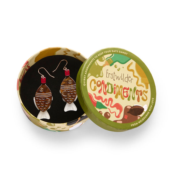 Pair of layered acrylic resin fish-shaped soy container earrings, shown in illustrated round box packaging