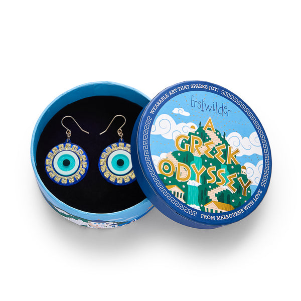 layered acrylic resin evil eye amulet dangle earrings in blue, white, and glitter gold, shown in illustrated round box packaging