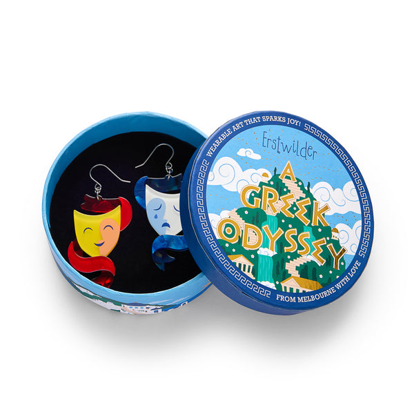 pair of layered acrylic resin comedy and tragedy mask dangle earrings, shown in illustrated round box packaging