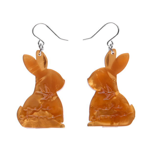 Orange rabbit-shaped earrings on a white background