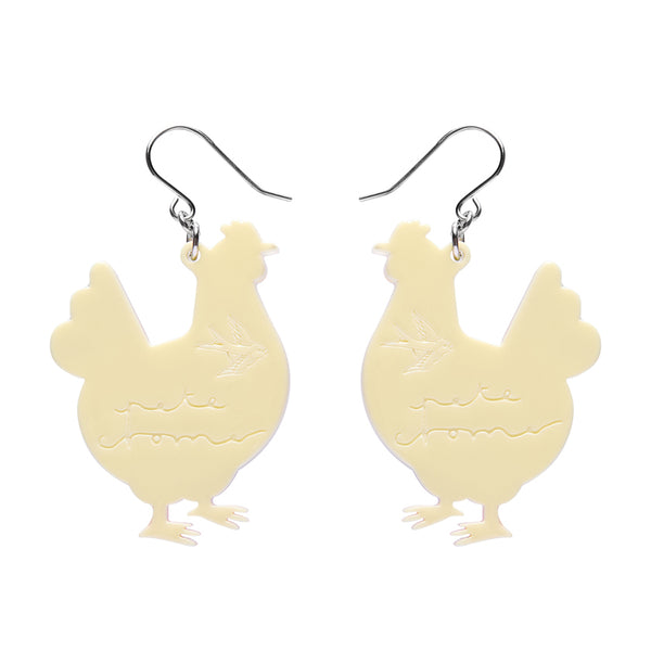 Chicken-shaped earrings on a white background