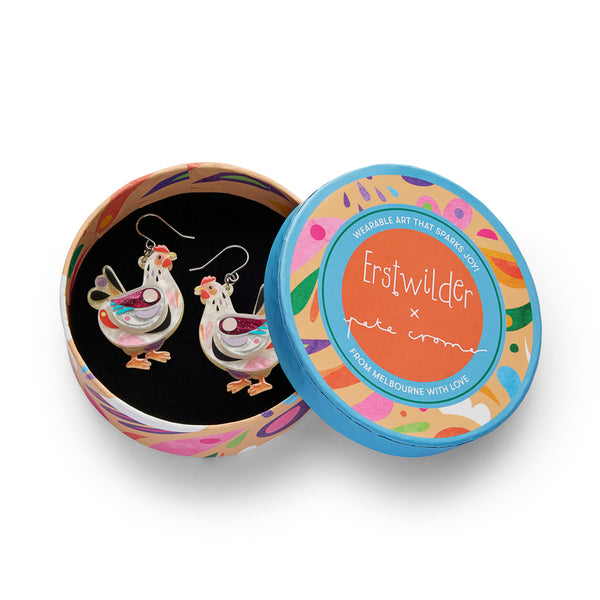 pair of colorful layered acrylic resin chicken-shaped earrings, shown in illustrated round box packaging