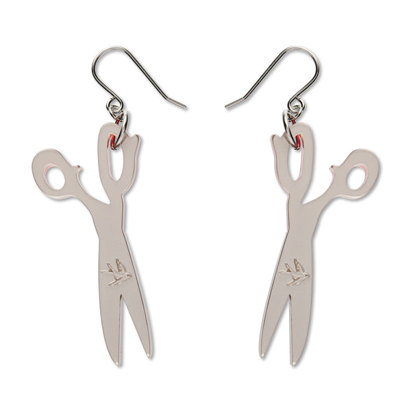 Scissor-shaped earrings on a white background