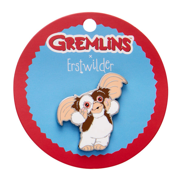 Gremlins character on a round card with 'Erstwilder' branding