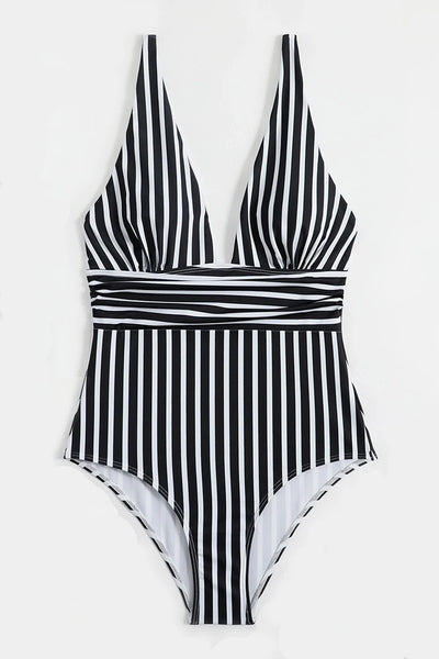 black and white vertical stripe one-piece swimsuit featuring adjustable straps, a plunging v-neckline, a contrast horizontal stripe cummerbund style ruched waistband, and a high-cut leg. shown flatlay