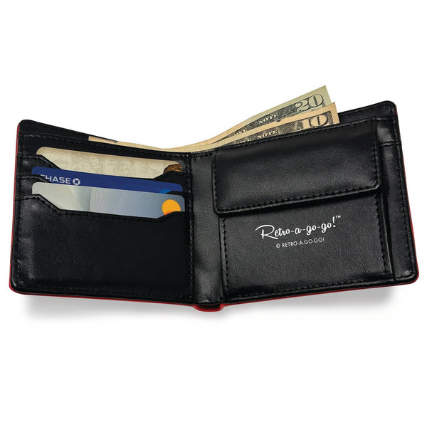 black faux leather billfold style wallet with an all-over exterior printed pattern of vintage ads from the back of comic books. Shown open to display card slots, buttoned pocket, and bill pocket 