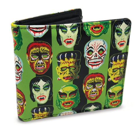 black faux leather billfold style wallet with an all-over exterior printed pattern of black and bright green vertical stripes behind a repeating pattern of colorful retro Halloween monster masks. Shown closed from the front