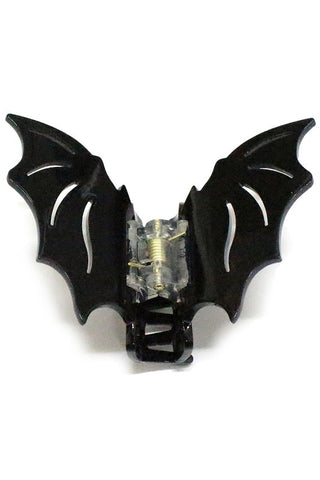 Claw hair clip in the shape of a black bat’s wings 