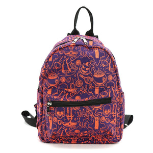 A mini backpack with a witchy themed pattern of bubbling cauldrons, ghosts, vials of mysterious liquids, pointy hats, candles, and child-enticing pieces of candy in orange on a purple background. Seen from the front