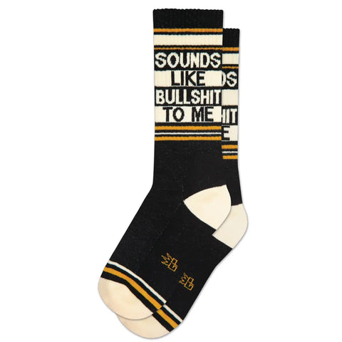 "Sounds Like Bullshit To Me" text and striped design in peach, mustard yellow, and black ribbed knit stretch cotton blend crew length gym socks, shown flat