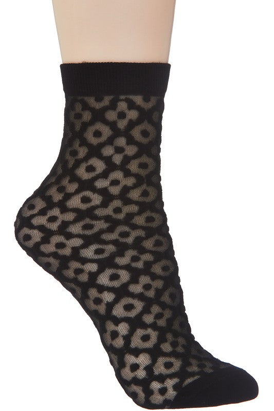 Sheer socks in a classic black floral diamond pattern with solid black cuffs and toes