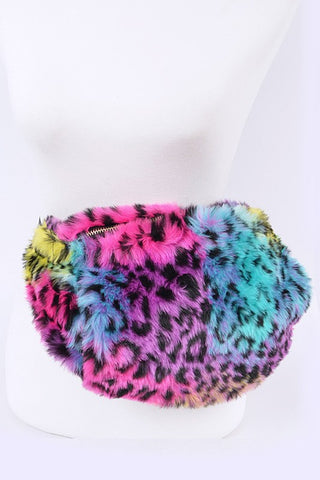 rainbow leopard print faux fur fanny pack purse with top zipper closure and muff feature, back zipper closure, inner zippered pocket, and adjustable 1 1/2” wide black strap. Shown on hip of dress form 