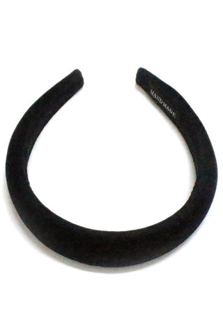 A 1 1/4” wide headband in black faux suede