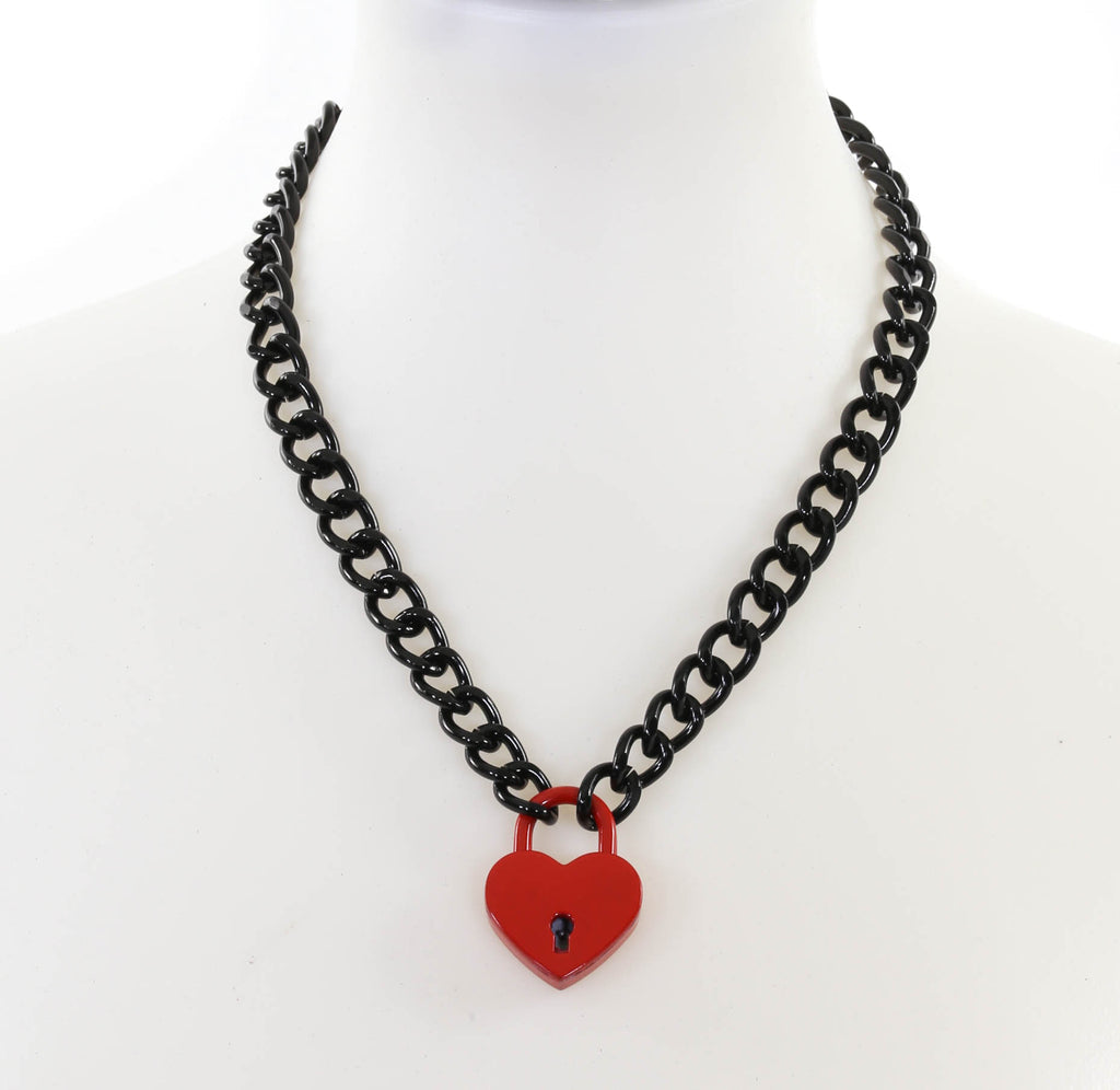 20” enameled black metal link chain with a 1” heart-shaped padlock in a shiny red finish. Key on a split key ring is attached to the lock for opening and closing the padlock