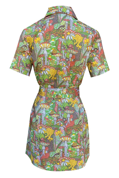 A short sleeved mini dress with an exaggerated pointed collar and green plastic zipper down the front. It has a psychedelic pattern with motifs including star spotted mushrooms, daffodils, paisley, snails, and pinwheels- in shades of yellow, red, green, and black. Shown from back zipped with sash belt