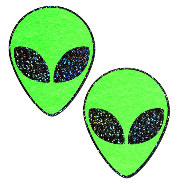 A pair of neon green alien head shaped pasties with black glitter eyes