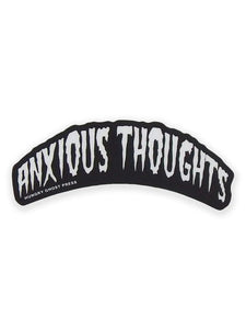 A die-cut vinyl sticker with the words “ANXIOUS THOUGHTS” written in white in a wavy horror movie font on a black background 