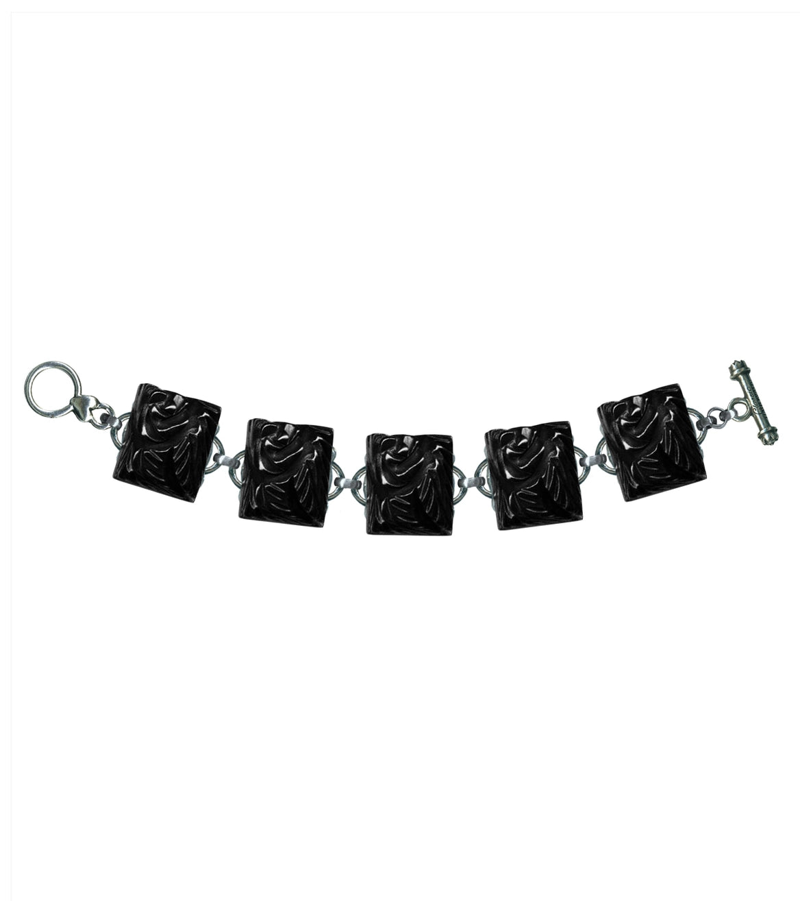 silver plated toggle closure bracelet with a single row of rectangular black floral charms made of durable hand poured poly resin made to mimic vintage Bakelite