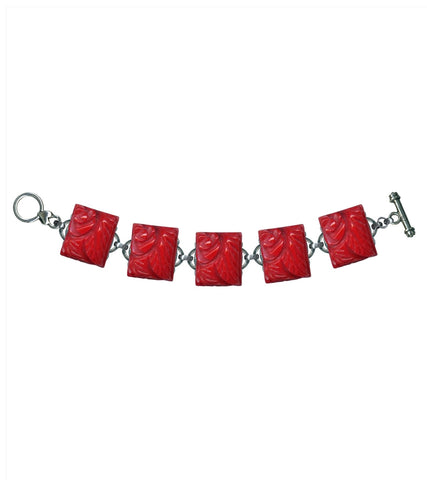 silver plated toggle closure bracelet with a single row of rectangular red floral charms made of durable hand poured poly resin made to mimic vintage Bakelite