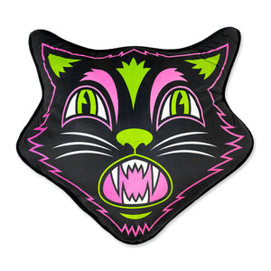 plush pillow in the shape of a black cat’s head with digitally printed white and neon pink and green details