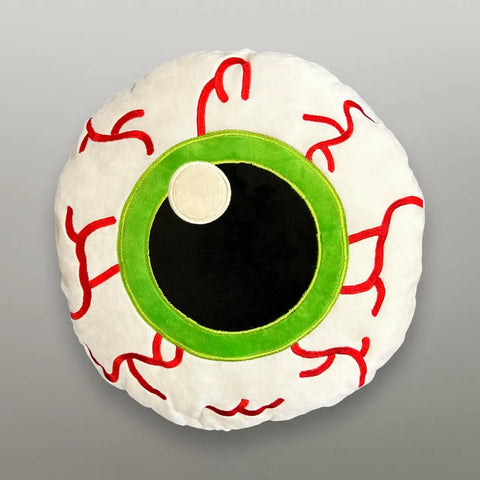Plush pillow in the shape of a round bloodshot eyeball with bright green iris