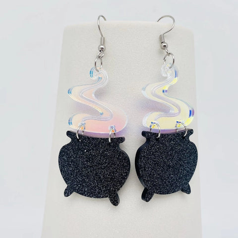 Glittery black acrylic witchy cauldrons with linked iridescent flash finish plume of smoke dangle earrings