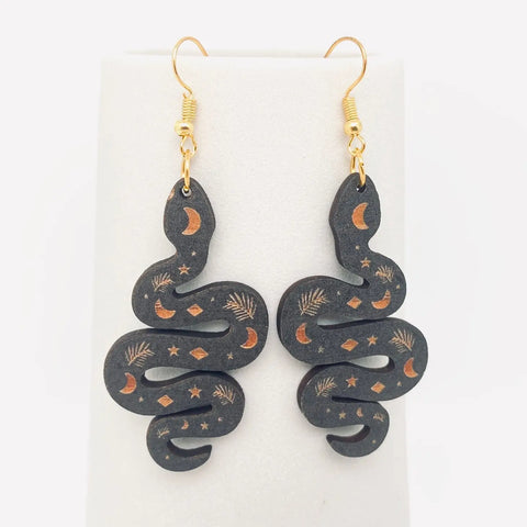 Wooden black snake dangle earrings with brown moon and diamond details