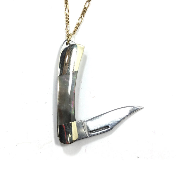 28” long brass Figaro style chain necklace with a mini stainless steel pocket knife pendant. Pendant has an abalone style finish on the handle. Shown up close with knife open
