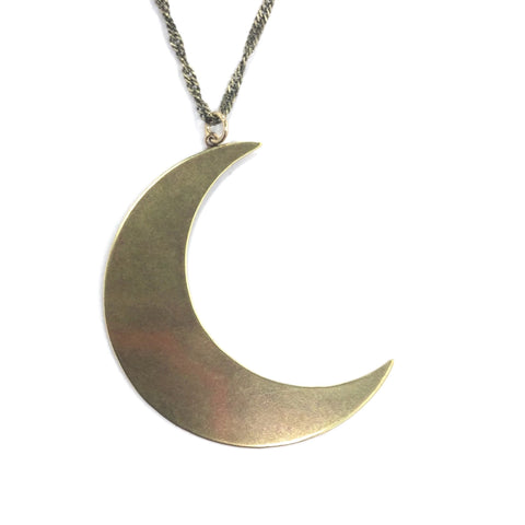 26” shiny gold metal fancy link style necklace with a large gold metal crescent moon pendant. Shown up close 