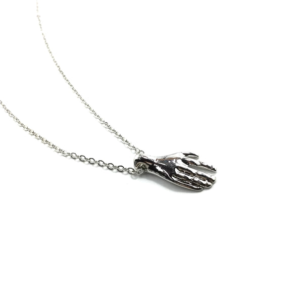 18” silver metal link style chain necklace with a detailed shiny silver hand pendant. Shown up close