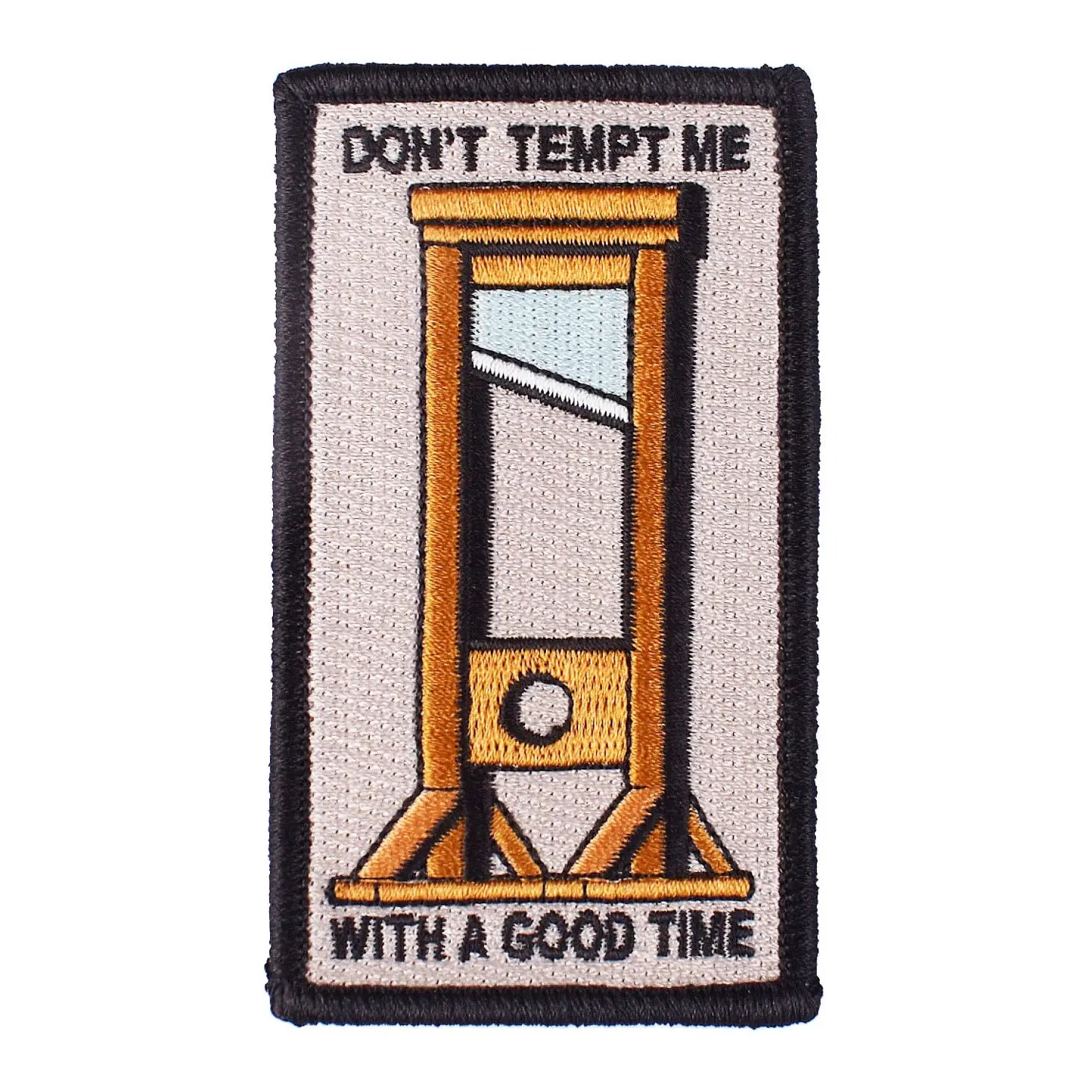 Rectangular embroidered patch with a black border featuring an image of a brown wooden guillotine with the message “DON’T TEMPT ME WITH A GOOD TIME” on a light grey background 