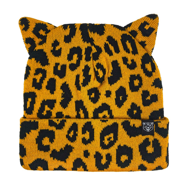 black and orange leopard print (with subtle bats in the pattern) knit hat with a set of pointy little matching cat ears on top and a rolled cuff