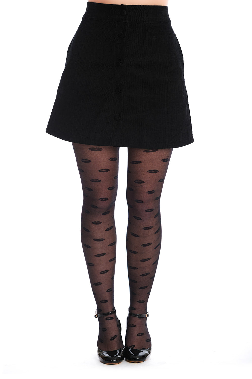 black corduroy button-front full a-line skirt in a above the knee length with side seam pockets. Shown on a model wearing patterned tights from the front
