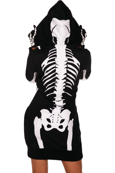 A model wearing a black fleece long sleeved zip up dress with a hood. It has a white anatomical skeleton motif. Shown from the back