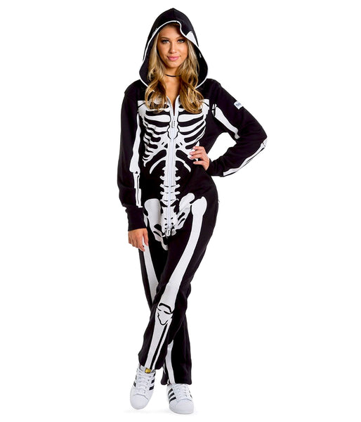 A female model wearing a black lightweight fleece zip-up jumpsuit with an all-over anatomical skeleton screen printed motif. The zipper runs to the top of the hood and it has two mesh covered eye holes. Seen from the front zipped to the neck