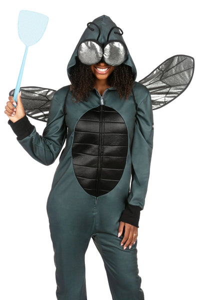 Female model wearing a polyester unisex fly costume jumpsuit. It is dark grey with a black thorax detail on the center of the stomach and has an oversized hood with silver lamé eyes and posable antennae. Shown with hood up and covering eyes, wearing posable silver lamé wings and holding blue plastic fly swatter. Shown from front