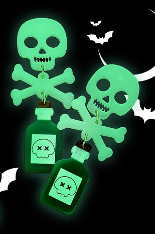 Drop earrings of poison bottles with a cartoony skull warning sign attached to a pair of skull and crossbones