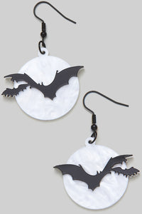 Acrylic black bats flying against a pearly white full moon dangle earrings