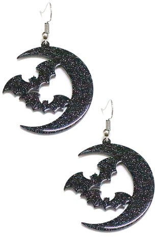 Glittery black acrylic dangle earrings in the shape of a pair of bats flying next to a crescent moon