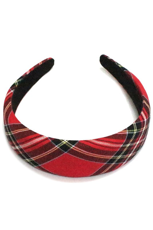 1 3/4” wide headband in a classic red, black, blue, and yellow plaid pattern
