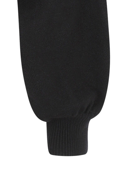 Black pullover sweater with slightly ballooned sleeves. Sleeve cuff shown in close up