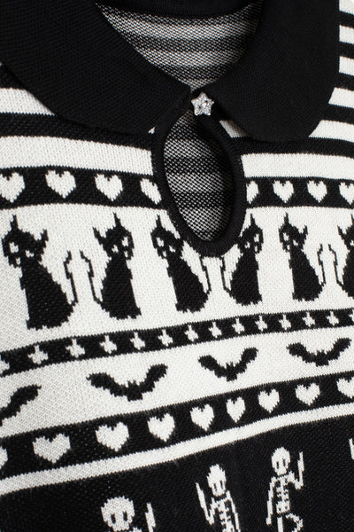 black and white striped short sleeve sweater with a black Peter Pan collar with keyhole and Fair Isle style pattern of black cats, hearts, skeletons, and coffins. Shown in close up of pattern and keyhole