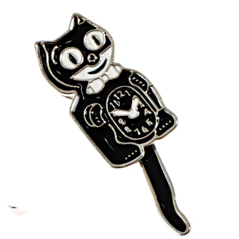 Silver black and white enamel pin of a Kit Cat Clock with articulated moving tail. Shown from front 