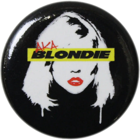1.25” round pinback button of a white, red, and yellow stencil style of Debbie Harry